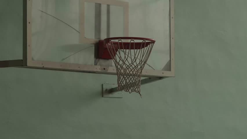 shot in basketball during the game at indoor playground. basketball ball hitting the basket. indoor basketball hoop in gym. throwing the ball into the ring.