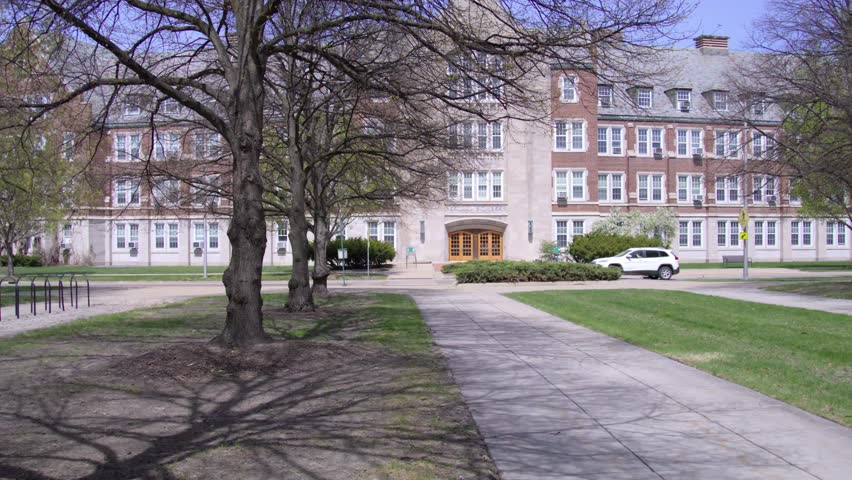 Exterior of College of Natural Sciences building on the campus of Michigan State University in East Lansing, Michigan with gimbal video moving sideways.