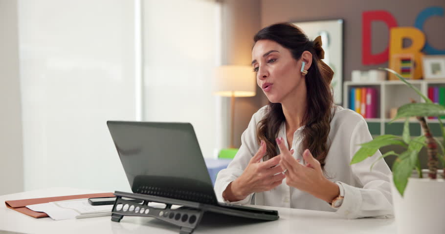 Laptop, therapist and woman in office for video call, consultation or advice with earphones. Computer, counseling and person in virtual meeting for mental health, help and talk to psychology teacher