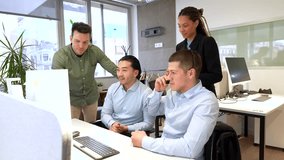 Office workers collaborating on a project, engaging in problem solving and teamwork around a computer - Powered by Shutterstock - Get 15% off with code: PIKWIZARD15