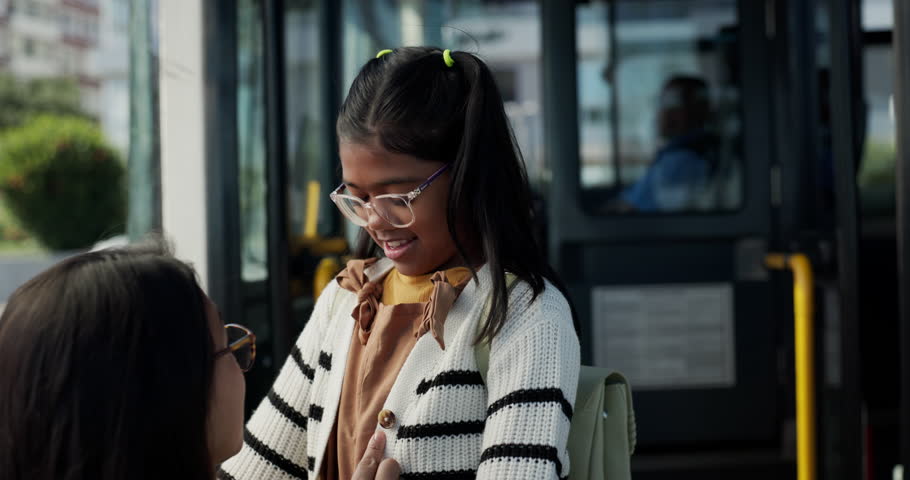 Leaving, child and hug for mom, bus and journey with public transport to school, good bye and smile. Commuting, woman and embrace for daughter in city, family and parent on first day of elementary