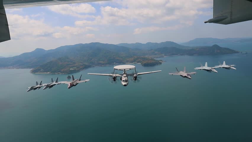 Military fighter jets flying over the sea