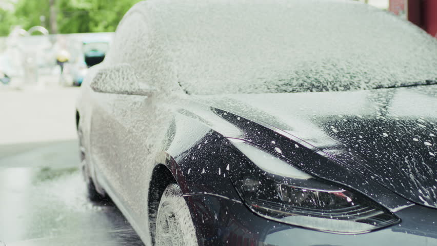 Washing Car with Foam at Outdoor Car Wash