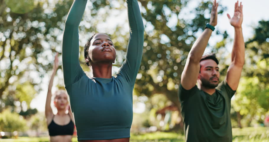 Outdoor, yoga and people with fitness, meditation and wellness with break, calm and relax. Group, yogi and friends in park, nature or zen with chakra, sunshine and stretching with breathing or rest