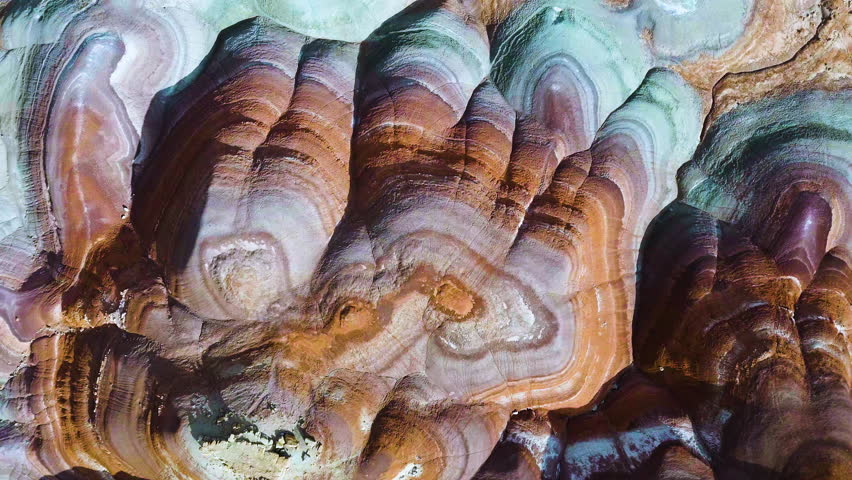 Cinematic aerial shot of abstract patterns of desert landscape in Hanksville, Utah, USA
