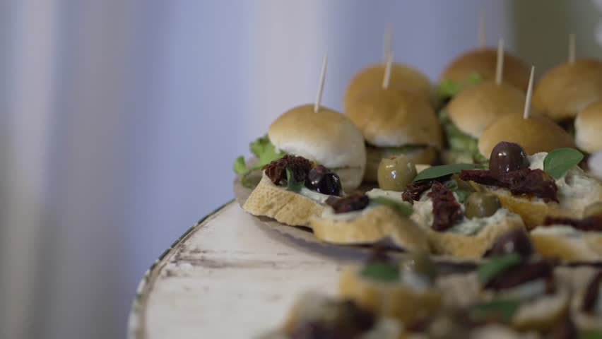 Tasty mini sandwiches and burgers served fresh as appetizers in cozy restaurant