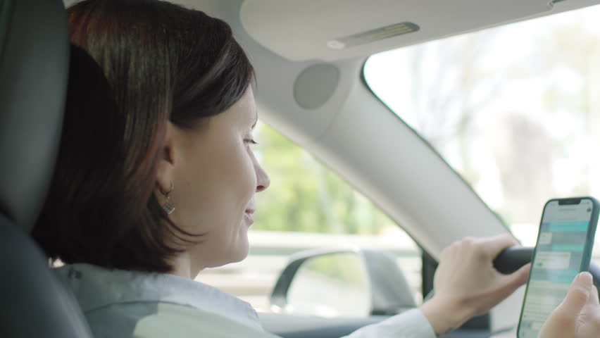 Woman Texting While Driving, Distracted Driving Concept
