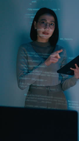 Vertical Screen : Group adult Asia female software developer mentor leader manager talk strategy plan to executive write prompt AI bot IT app program nomad, video game. Projecting slideshow code.