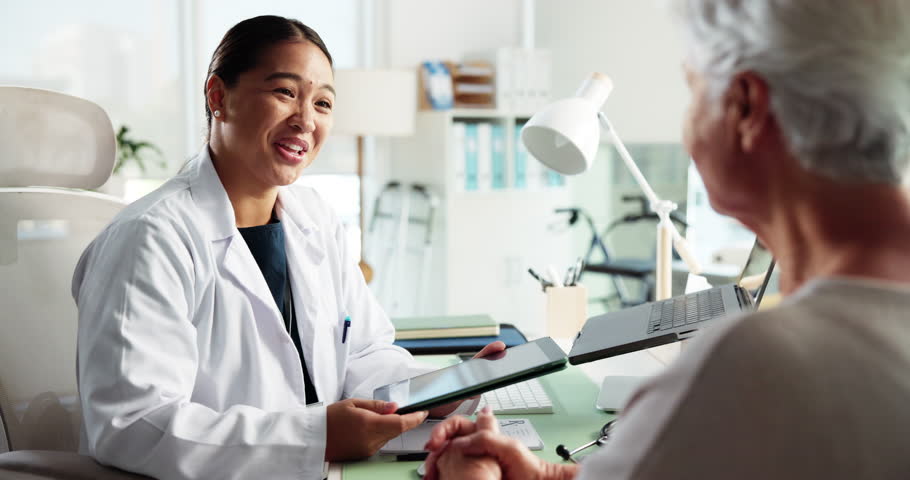 Handshake, consultation and doctor with senior woman in hospital for medical checkup with support. Conversation, greeting and elderly female patient shaking hands with healthcare worker for thank you