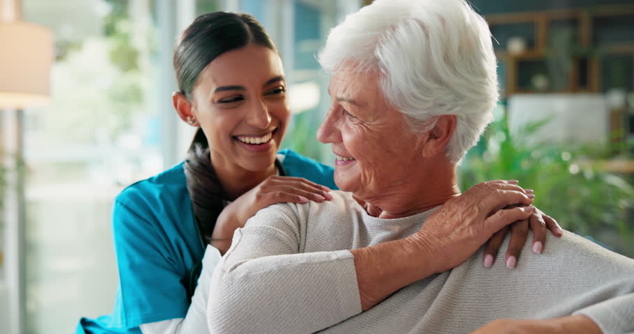 Nurse, smile and face of old woman on sofa for retirement, rehabilitation and occupational therapist. Healthcare, hug and support with people in nursing home for caregiver, elderly care and help