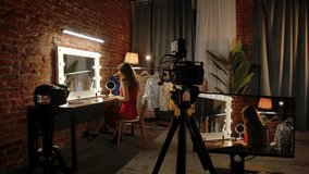 Backstage. A professional photographer captures a model in a chic studio with a fashion-centric setting, complete with a vanity mirror and stylish outfits. - Powered by Shutterstock - Get 15% off with code: PIKWIZARD15