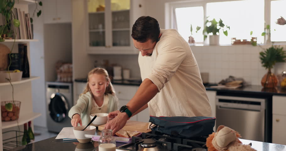 Dad, child and phone call with school for breakfast, packing or preparation in kitchen at home. Busy father, daughter or helping kid getting ready with bag for lunch, fist bump or first academic day