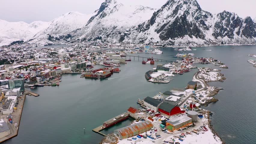 4k drone flight moving to the side footage (Ultra High Definition) of Henningsvaer town, Lofoten Islands, Norway. Splendid spring seascape of Norwegian sea. Traveling concept background.