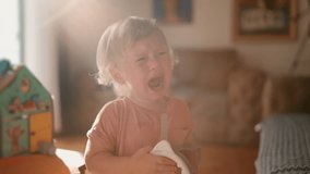 Parenting issues. Close up portrait of upset cute american baby boy crying in fathers hands, feeling stressed and annoyed, tracking shot, slow motion - Powered by Shutterstock - Get 15% off with code: PIKWIZARD15
