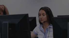 Female call center agents typing error logs at workstations, showing floating software code overlay. Professional, technology, communication, workflow, collaboration, modern, digital - Powered by Shutterstock - Get 15% off with code: PIKWIZARD15