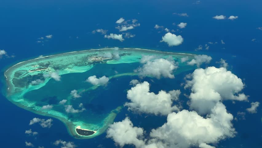 4k Aerial video footage, flying along the Island of Finolhu, Thulhaadhoo and Maagandu . The Atoll with lagoon and islands is located on the  Baa Atoll, Maldives in Indian Ocean 
