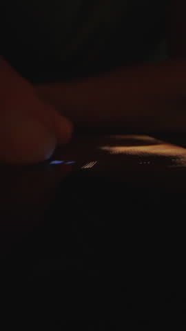 A person views photos and videos in the mobile device gallery, scrolling through images and media content on the smartphone screen