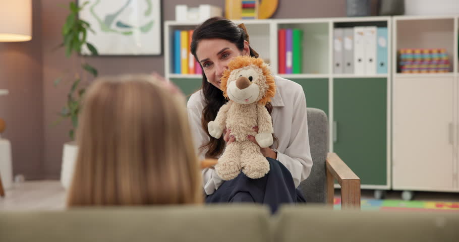 Therapy, psychologist and woman with child, toys or ADHD with education, role play or help. Consulting, therapist and girl kid in session with counseling evaluation, development or stuffed animals