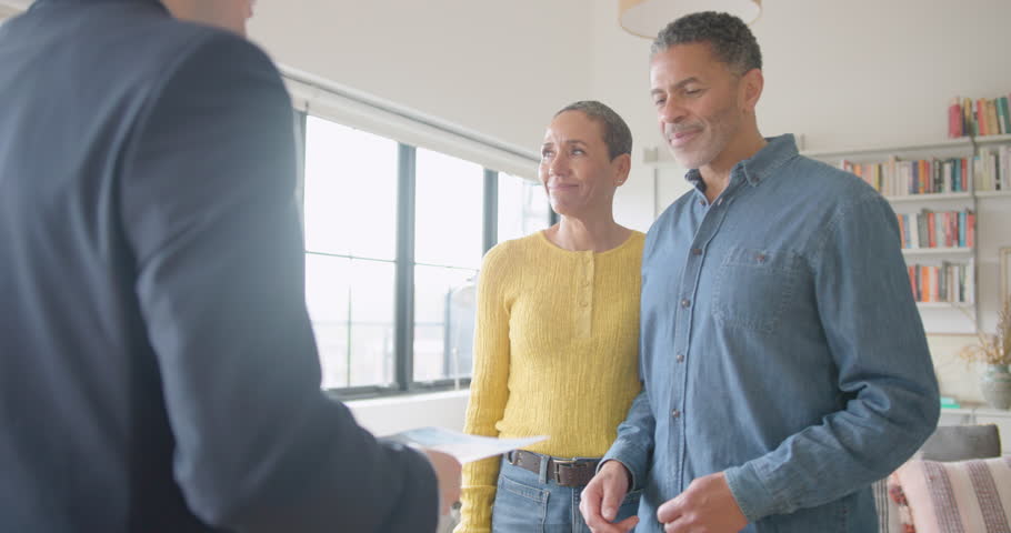 Realtor showcasing a home with potential buyers