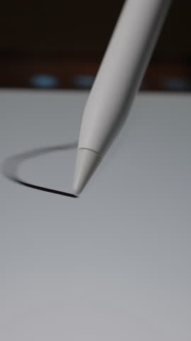 Using a stylus pen to create abstract scribbles on a digital tablet screen