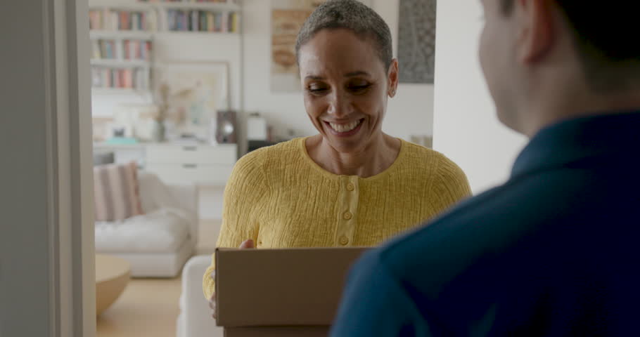 Woman Receiving a Package at Her Doorstep