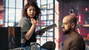 In a tech driven studio, team edits smartphone video footage on a dual monitors setup, applying professional tools for video creation. Targeting algorithm shifts and maximizing engagement. Camera B. - Powered by Shutterstock - Get 15% off with code: PIKWIZARD15