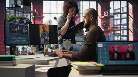 In a tech driven studio, team edits smartphone video footage on a dual monitors setup, applying professional tools for video creation. Targeting algorithm shifts and maximizing engagement. Camera A. - Powered by Shutterstock - Get 15% off with code: PIKWIZARD15