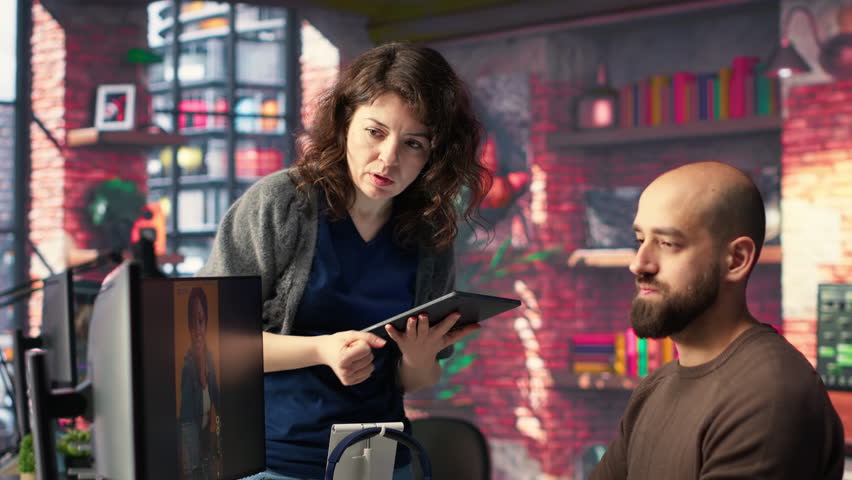 Professional editor uses AI powered software and PC reels in a creative office, marketing strategy used in targeting viral trends and boosting online followers and exposure. Camera B.