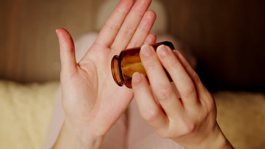 Pills and vitamins macro, Close up view of womans hands holding plenty of different drugs. Painkillers and antibiotics. Healthcare and medicine concept