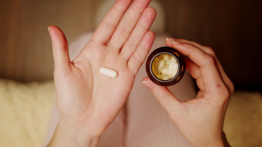 Pills and vitamins macro, Close up view of womans hands holding plenty of different drugs. Painkillers and antibiotics. Healthcare and medicine concept