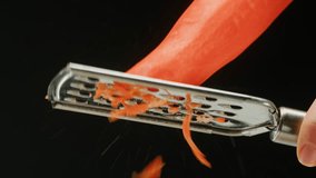 Carrot macro, Woman hands with a grater grate carrots on the wooden board, chef cooking polish potato pancakes in the kitchen. Healthy eating and lifestyle.  - Powered by Shutterstock - Get 15% off with code: PIKWIZARD15