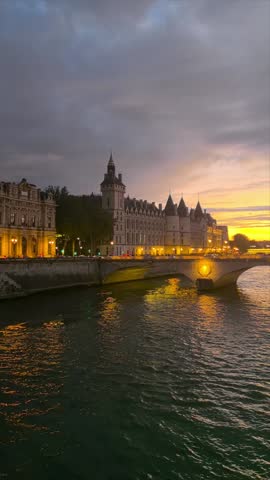 Seine River Bridge and Historic Buildings at Sunset in Paris
