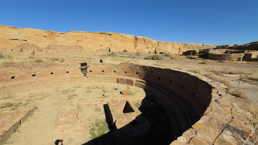 Overhead view of circular kiva ruin with stairways and chambers in deserted Chaco Canyon, New Mexico.
