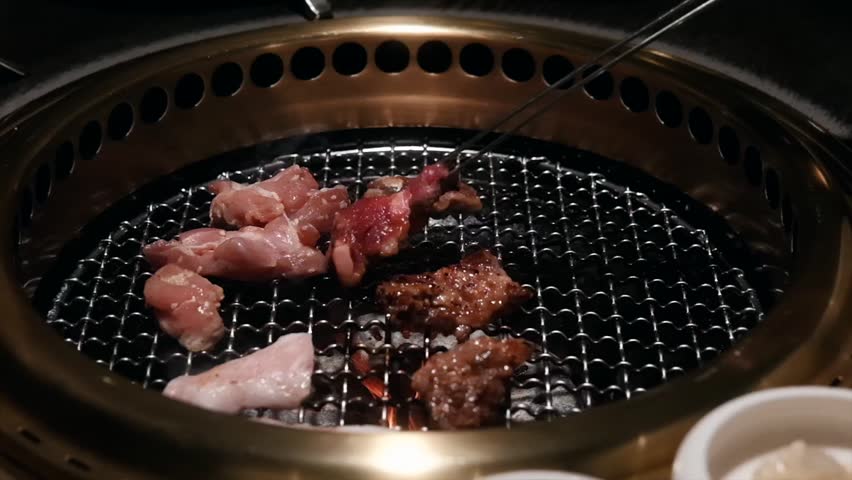 HD 1080p slow motion for cooking Korean BBQ with beef and meat. Epic flame and smoke.