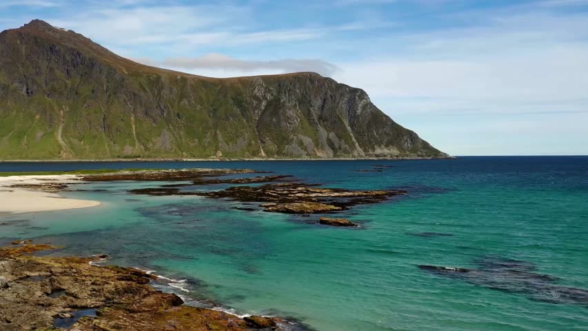 Scenic Coastal Landscape with Mountain and Rocky Shore