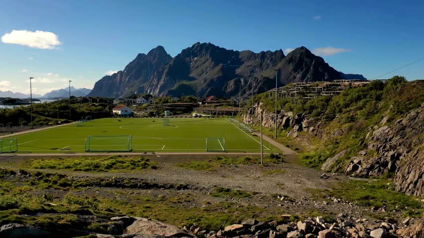 Panoramic View of Soccer Field with Mountain Background