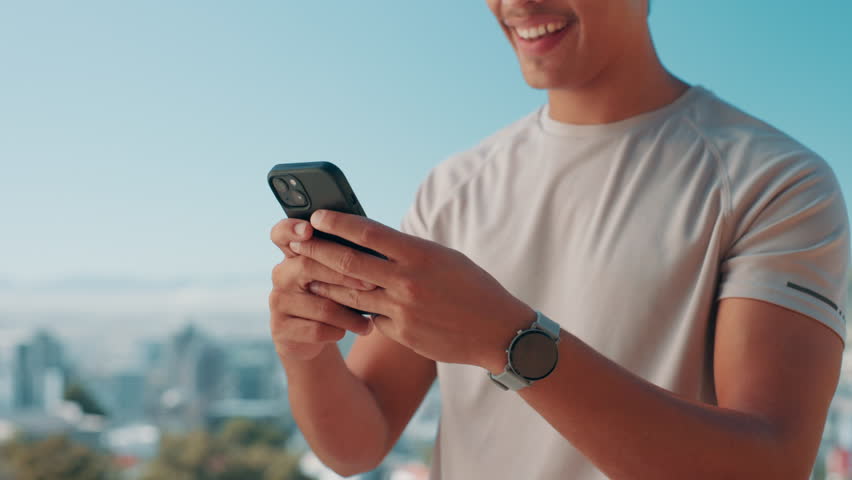 Man, hands and typing with phone for fitness app, chatting or texting on mountain view. Closeup, male person or user with smile or smart watch on mobile smartphone for health tracker or social media