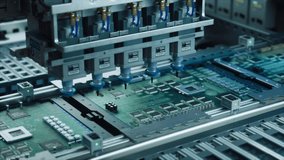 Close Up Macro Footage of Electronic Printed Circuit Board Being Assembled with Automated Robotic Arm, Surface Mounted Technology Connecting Microchips, Semiconductors, Capacitors to the Motherboard - Powered by Shutterstock - Get 15% off with code: PIKWIZARD15