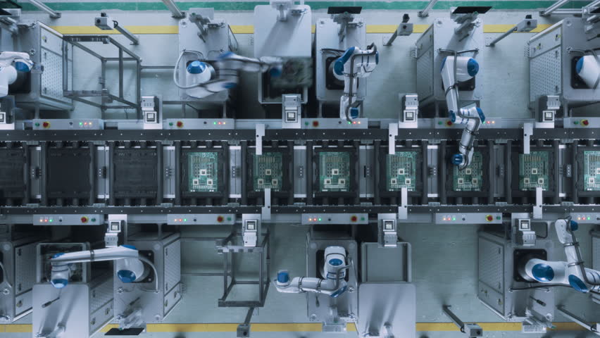 Top Down Footage with Automated Factory Floor with Robotic Arms Producing Computer Components, Fabricating Circuit Boards with Microchips. Futuristic AI Manufacturing of Robotics. Static Shot