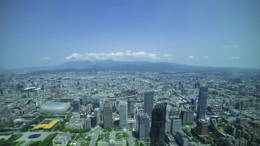 A timelapse of panoramic cityscape around Taipei101 skyscraper in Taiwan zoom