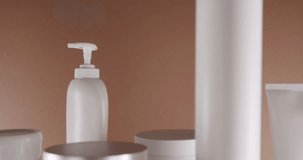 Cosmetics oils based on natural ingredients, scrub, tonic, body care. Natural cosmetics production for hair and skin care. Bottles and tubes for cosmetics and Beauty treatment on a brown background. - Powered by Shutterstock - Get 15% off with code: PIKWIZARD15