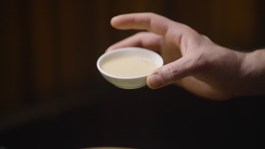 A close-up shot of goat cheese being drizzled with honey over a fresh salad, capturing the essence of gourmet cuisine.
