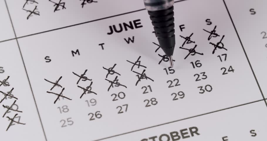 Someone is using a black pen to mark every date in June off a printed calendar. They put multiple x's over each date, symbolizing the passing of time or counting down the days. Dates On Calendar