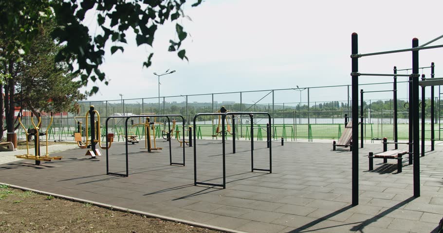 Empty outdoors gym. Sports ground for physical exercise on open air. exercise equipment. Sports ground with horizontal bars and other new exercise equipment in open air sport zone in the city.