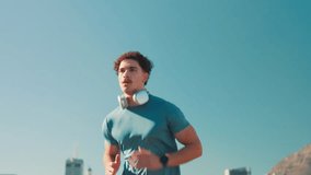 Athlete, man or check watch with running in city for progress monitor, performance tracking or cardio speed. Blue sky, runner or pace timer for marathon training, fitness challenge or workout results - Powered by Shutterstock - Get 15% off with code: PIKWIZARD15
