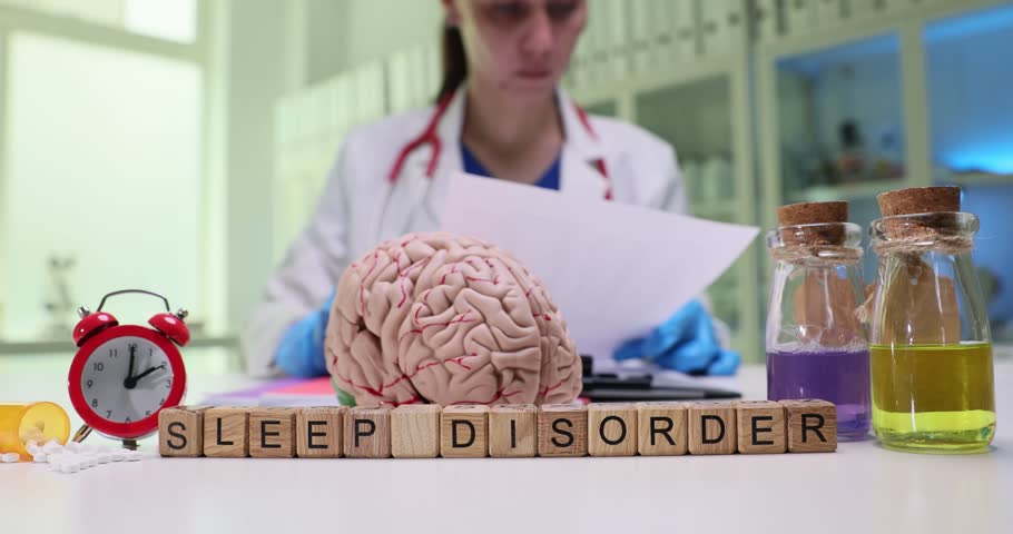 A medical professional closely examines and analyzes sleep disorder research by utilizing an advanced brain model