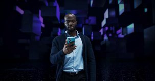African Man Using Smartphone in a Conceptual Space. Digital Visualization of Social Media, Influencer Economy, Viral Content. Augmented Reality with Floating Hologram Screens with Videos - Powered by Shutterstock - Get 15% off with code: PIKWIZARD15