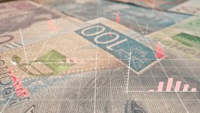 Stacked banknotes lying on surface while red declining bar graphs floating above. Digital financial data overlaying currency, representing economic downturn. Inflation and market instability concerns. - Powered by Shutterstock - Get 15% off with code: PIKWIZARD15