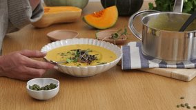 Preparing a Delightful Pumpkin Soup with Freshly Baked Bread for Dipping  - Powered by Shutterstock - Get 15% off with code: PIKWIZARD15