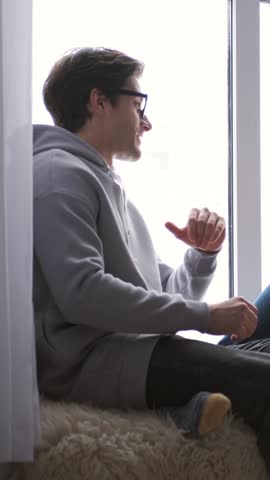 Couple Laughing Together While Enjoying Refreshing Entertainment At Home